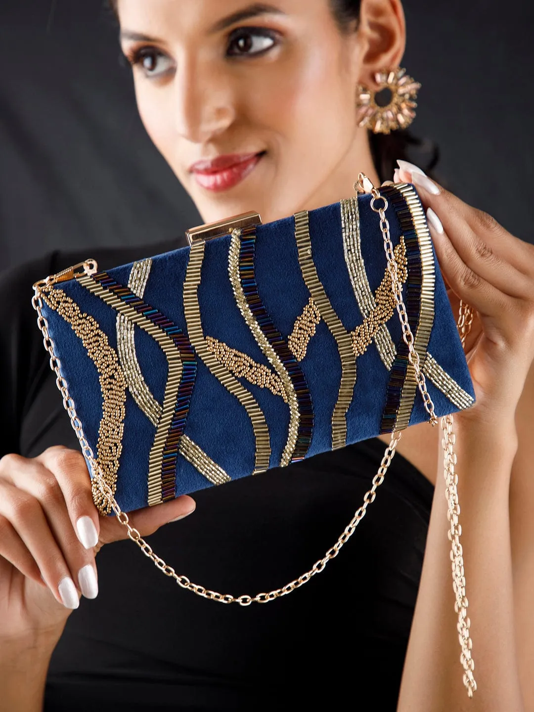 Rubans Blue Colour Box Clutch With Embroided Gold Design.